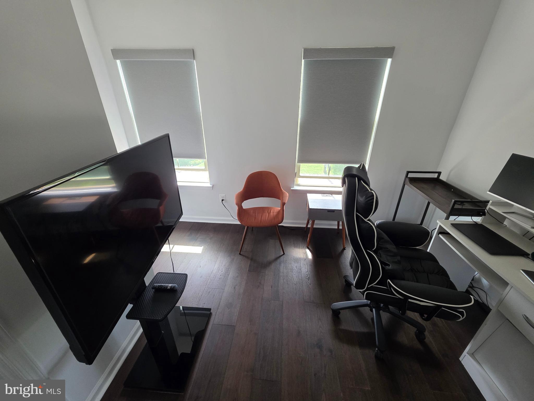 43815 Stubble Cor Square Ashburn, VA 20147 - Photo 16 of 23 a view of a workspace with furniture and wooden floor
