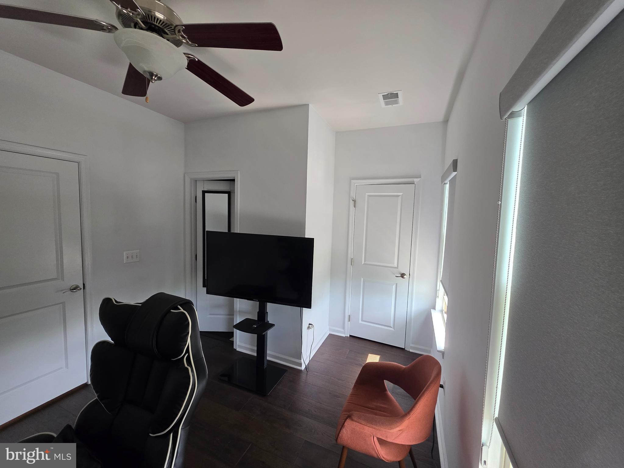 43815 Stubble Cor Square Ashburn, VA 20147 - Photo 17 of 23 a living room with furniture and a flat screen tv