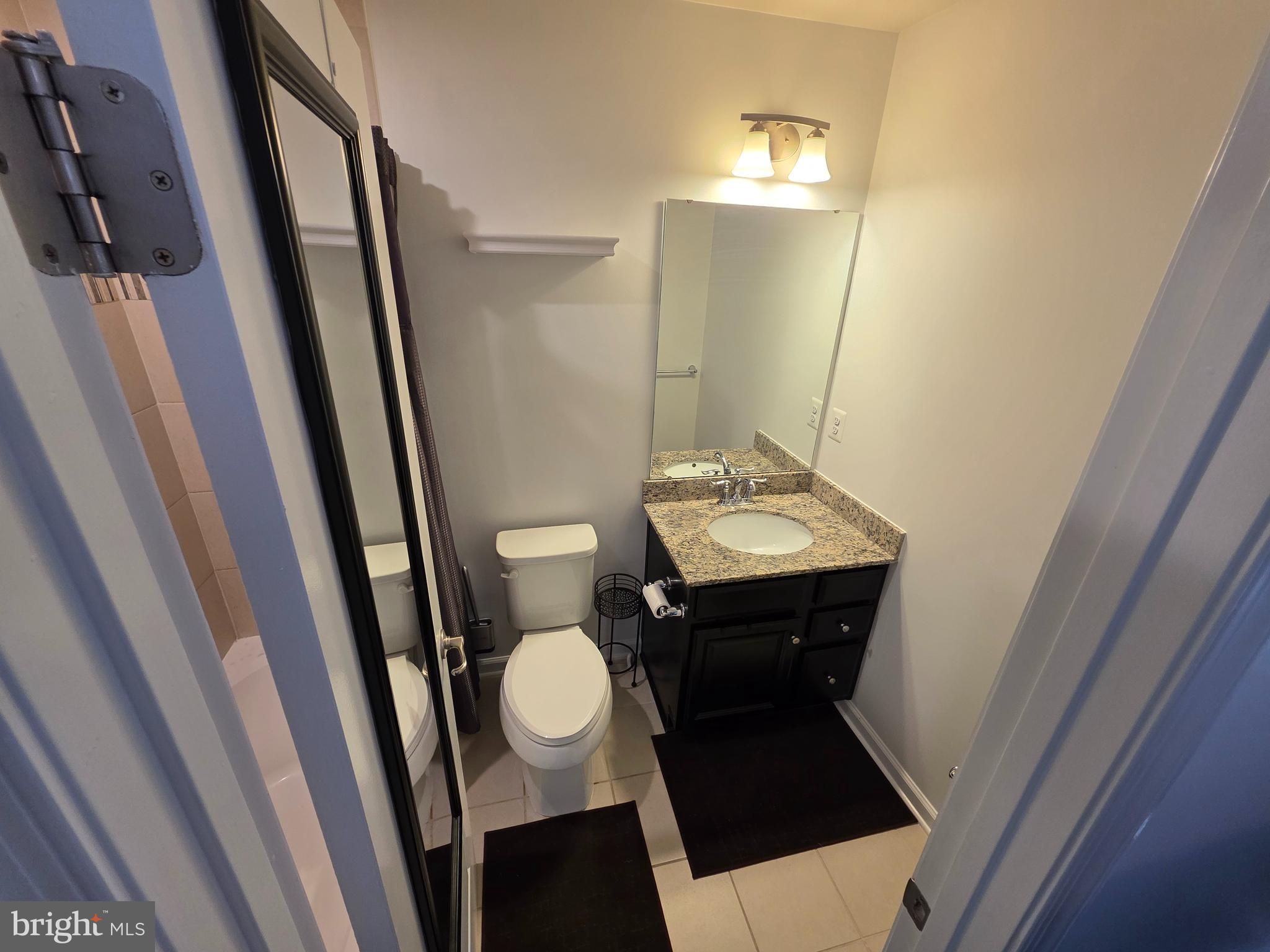 43815 Stubble Cor Square Ashburn, VA 20147 - Photo 18 of 23 a bathroom with a sink and a mirror