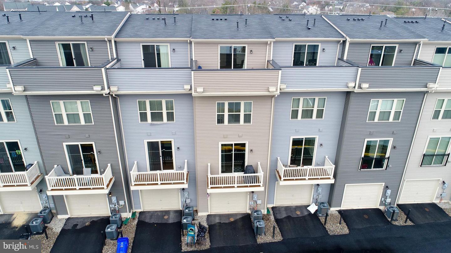 43815 Stubble Cor Square Ashburn, VA 20147 - Photo 20 of 23 a front view of a building with many windows