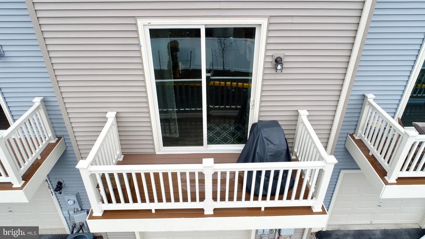43815 Stubble Cor Square Ashburn, VA 20147 - Photo 21 of 23 a view of a chair in wooden deck