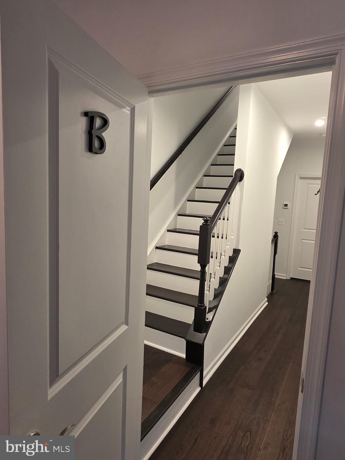 43815 Stubble Cor Square Ashburn, VA 20147 - Photo 10 of 23 a view of a hallway with staircase