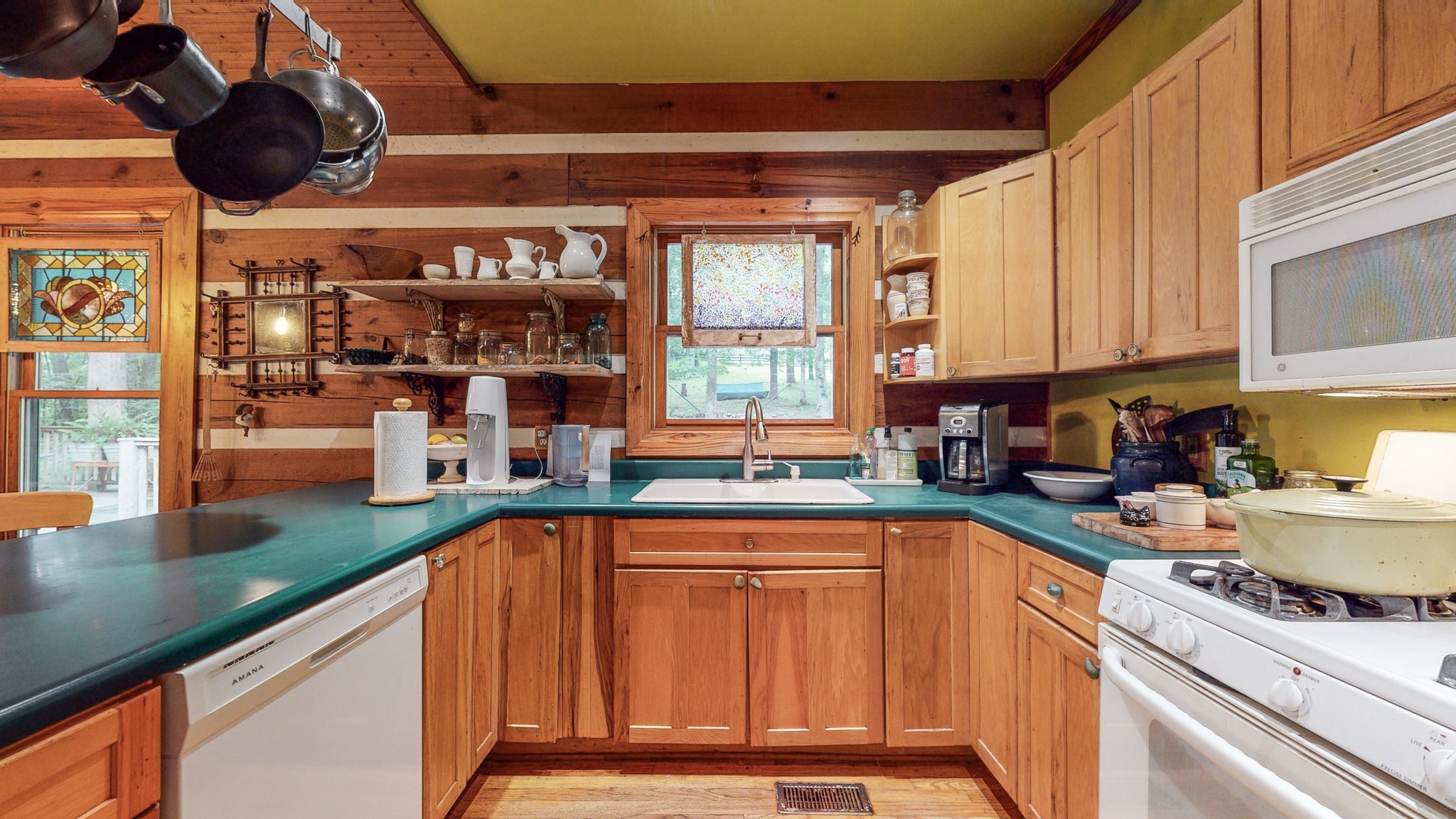 7715 Fernvale Road Fairview, TN 37062 - Photo 12 of 46 a kitchen with stainless steel appliances granite countertop a sink a stove and a wooden cabinets
