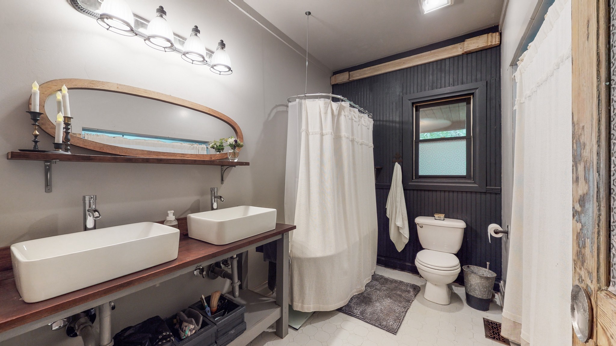 7715 Fernvale Road Fairview, TN 37062 - Photo 16 of 46 a bathroom with a sink a toilet and mirror