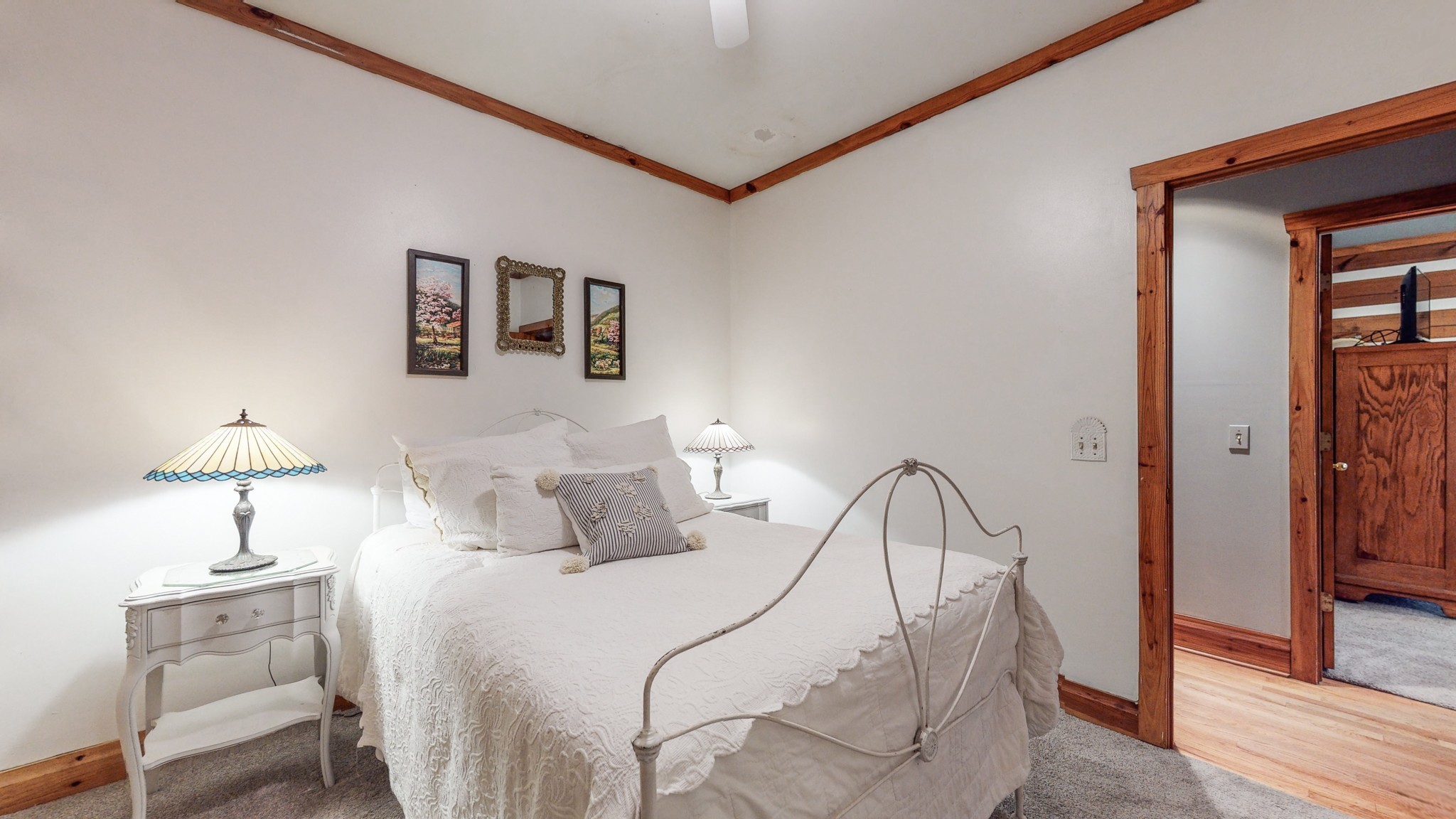 7715 Fernvale Road Fairview, TN 37062 - Photo 18 of 46 a bedroom with a bed and a chandelier