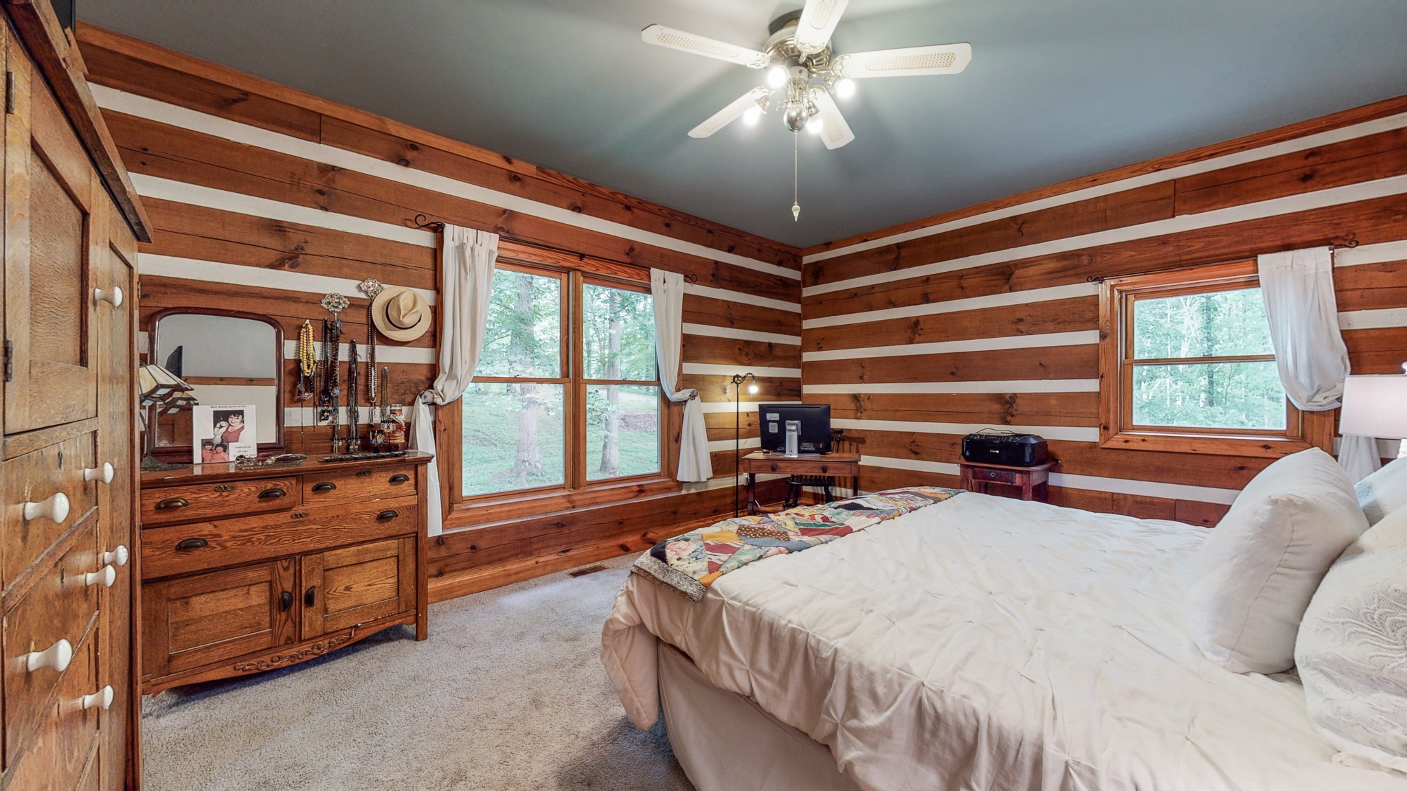 7715 Fernvale Road Fairview, TN 37062 - Photo 19 of 46 a bed room with a bed and a chandelier