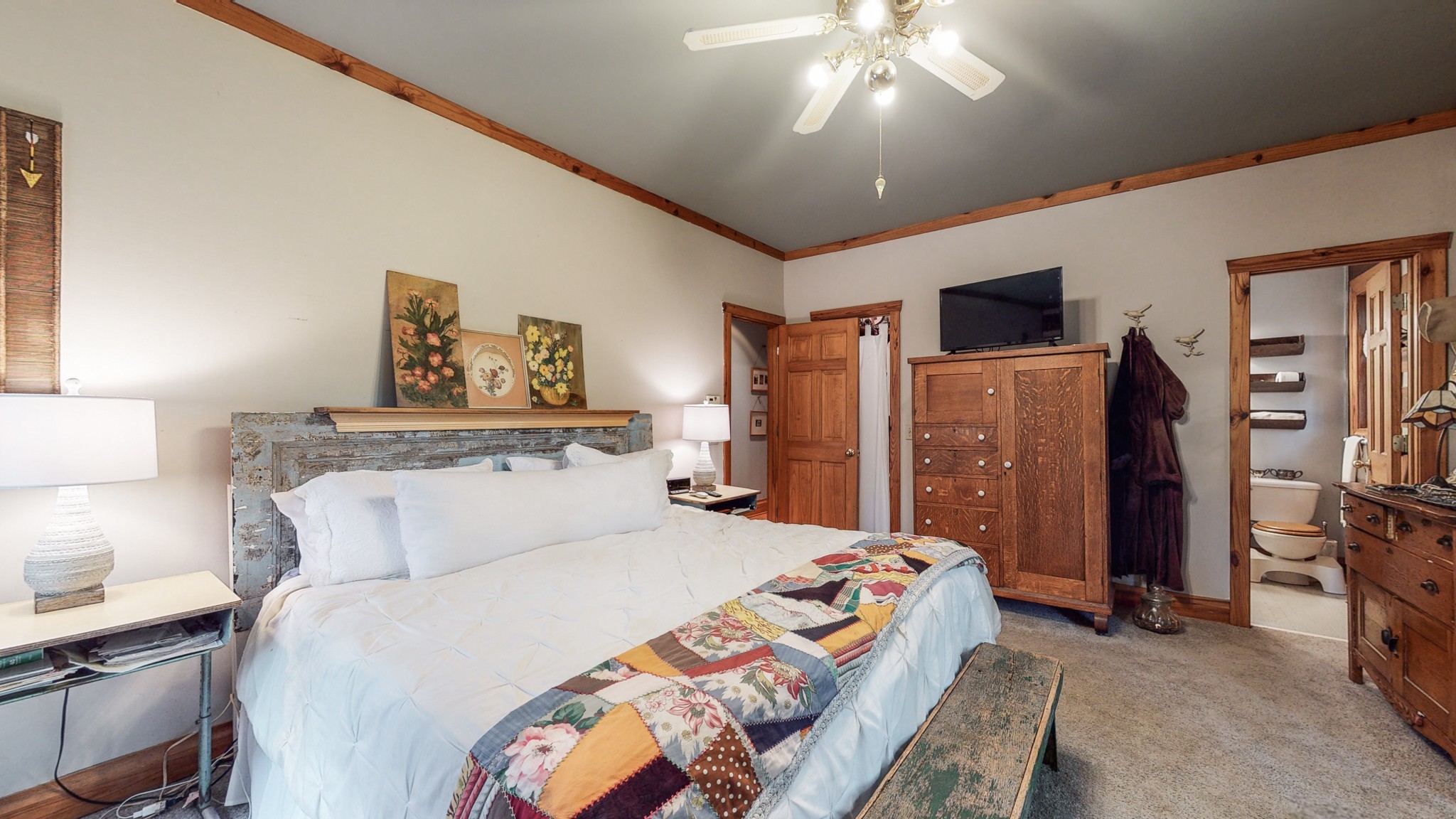 7715 Fernvale Road Fairview, TN 37062 - Photo 20 of 46 a bedroom with a bed and a chandelier