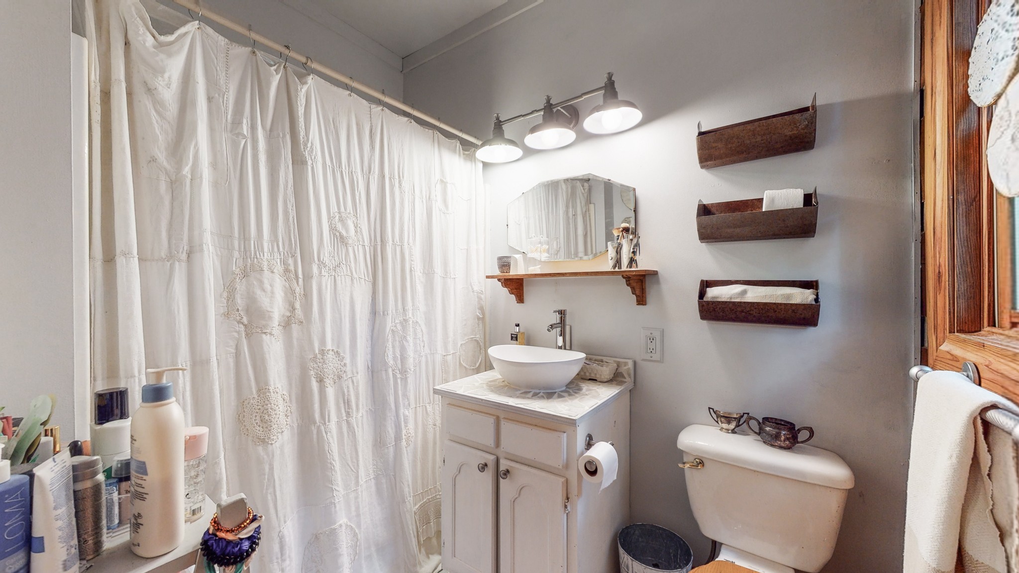 7715 Fernvale Road Fairview, TN 37062 - Photo 21 of 46 a bathroom with a toilet sink and mirror