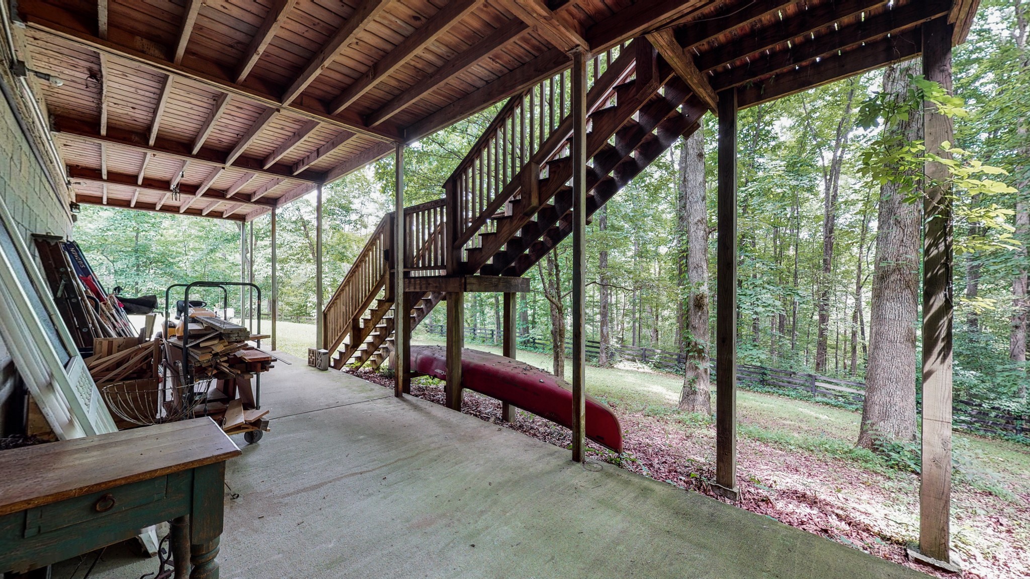 7715 Fernvale Road Fairview, TN 37062 - Photo 27 of 46 a view of porch with a table chairs and a couple of potted plants