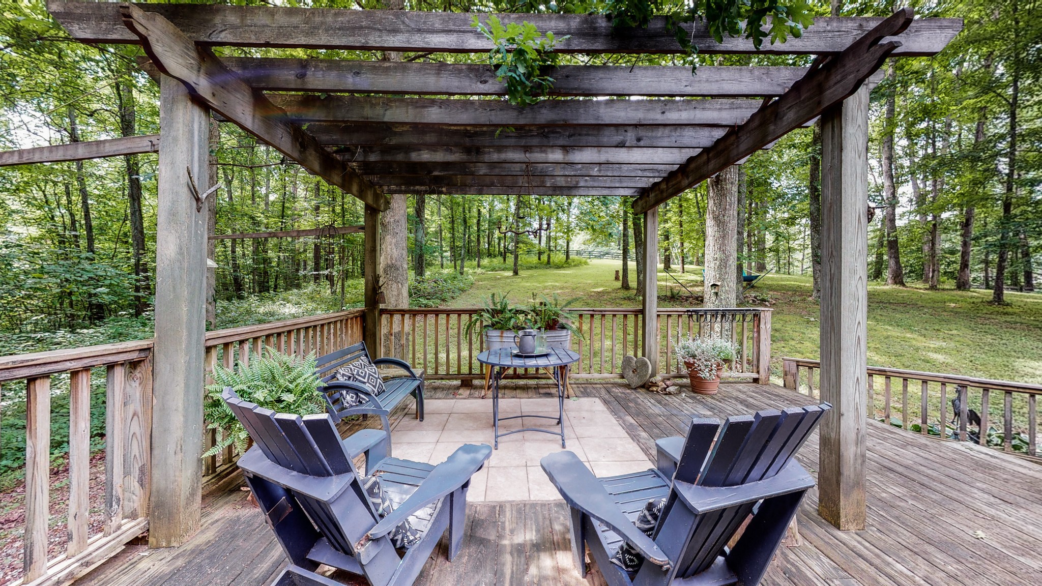 7715 Fernvale Road Fairview, TN 37062 - Photo 33 of 46 a view of a patio with chairs and wooden floor