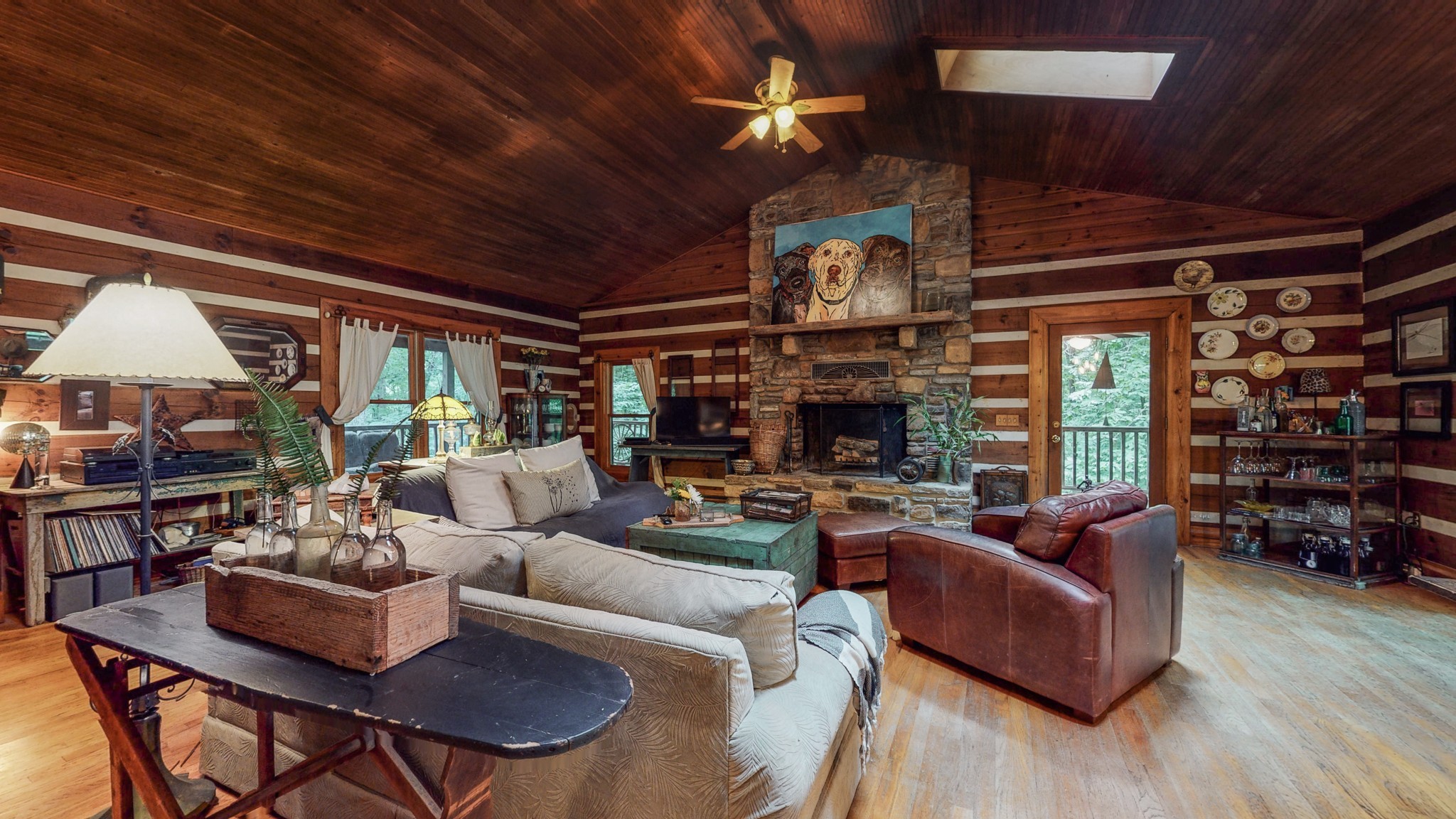 7715 Fernvale Road Fairview, TN 37062 - Photo 5 of 46 a living room with furniture a ceiling fan and a fireplace