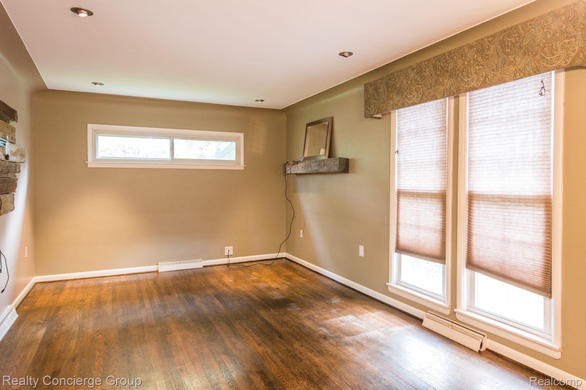 7525 Challis Road Brighton, MI 48116 - Photo 2 of 20 Spacious living room w/ natural light