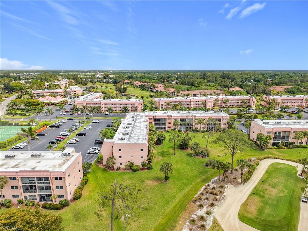 150 Turtle Lake Court, Unit 309 Naples, FL 34105 - Photo 39 of 42 an aerial view of residential houses with outdoor space and swimming pool
