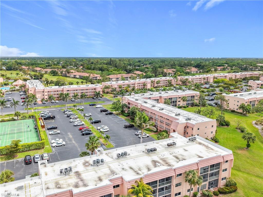 150 Turtle Lake Court, Unit 309 Naples, FL 34105 - Photo 7 of 42 an aerial view of a city with lots of residential buildings