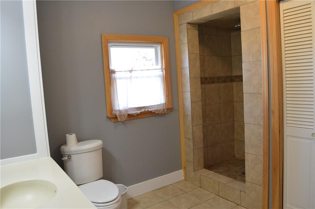 104 Enfield Road Lincoln, ME 04457 - Photo 23 of 29 2nd floor bathroom with tile walk in...