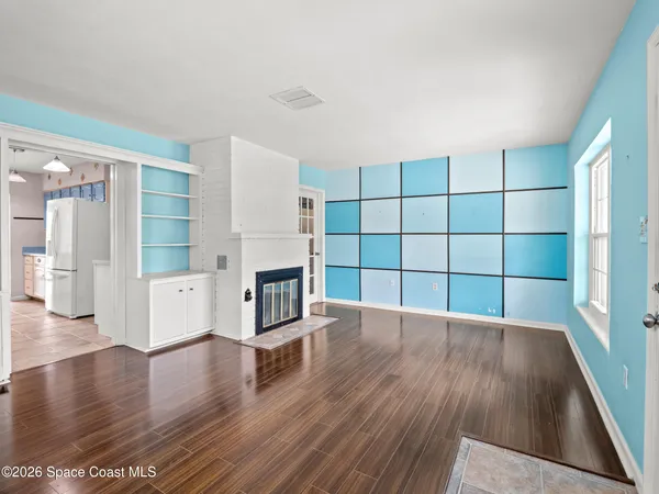 a view of a livingroom with wooden floor