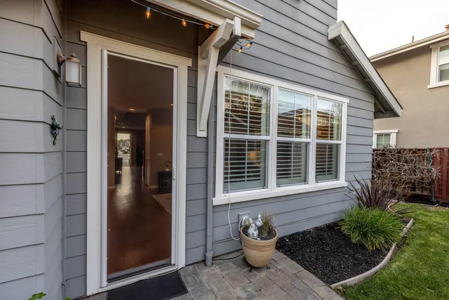 a view of a house with a yard and sitting space