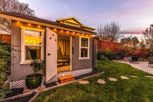 a backyard of a house with lots of green space