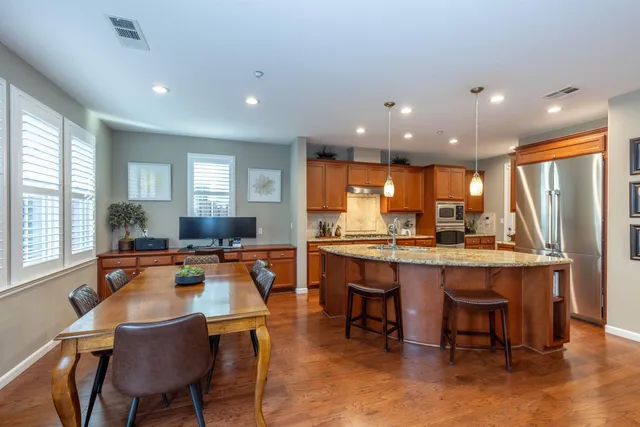 a view of a dining room with furniture window and outside view