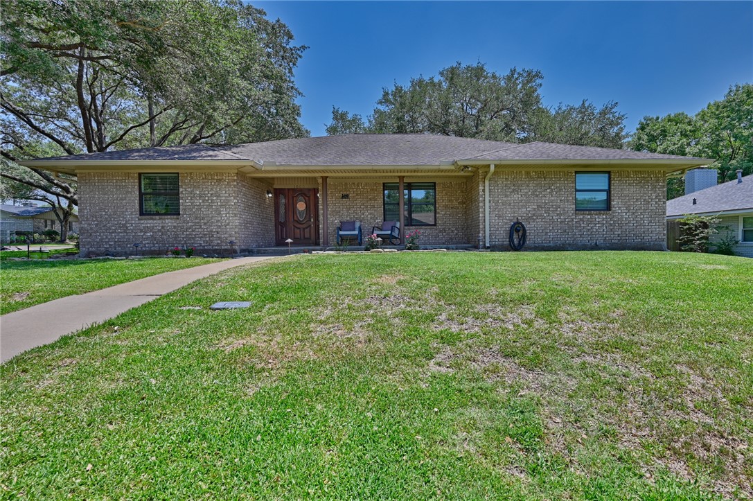 1600 Pecan Street Brenham, TX 77833 - Photo 1 of 33 Ranch-style home with covered porch, brick siding and a large front lawn