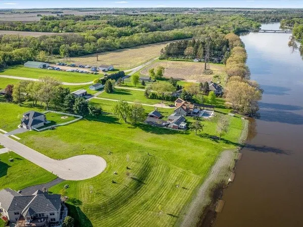 an aerial view of a house with a swimming pool yard and outdoor seating