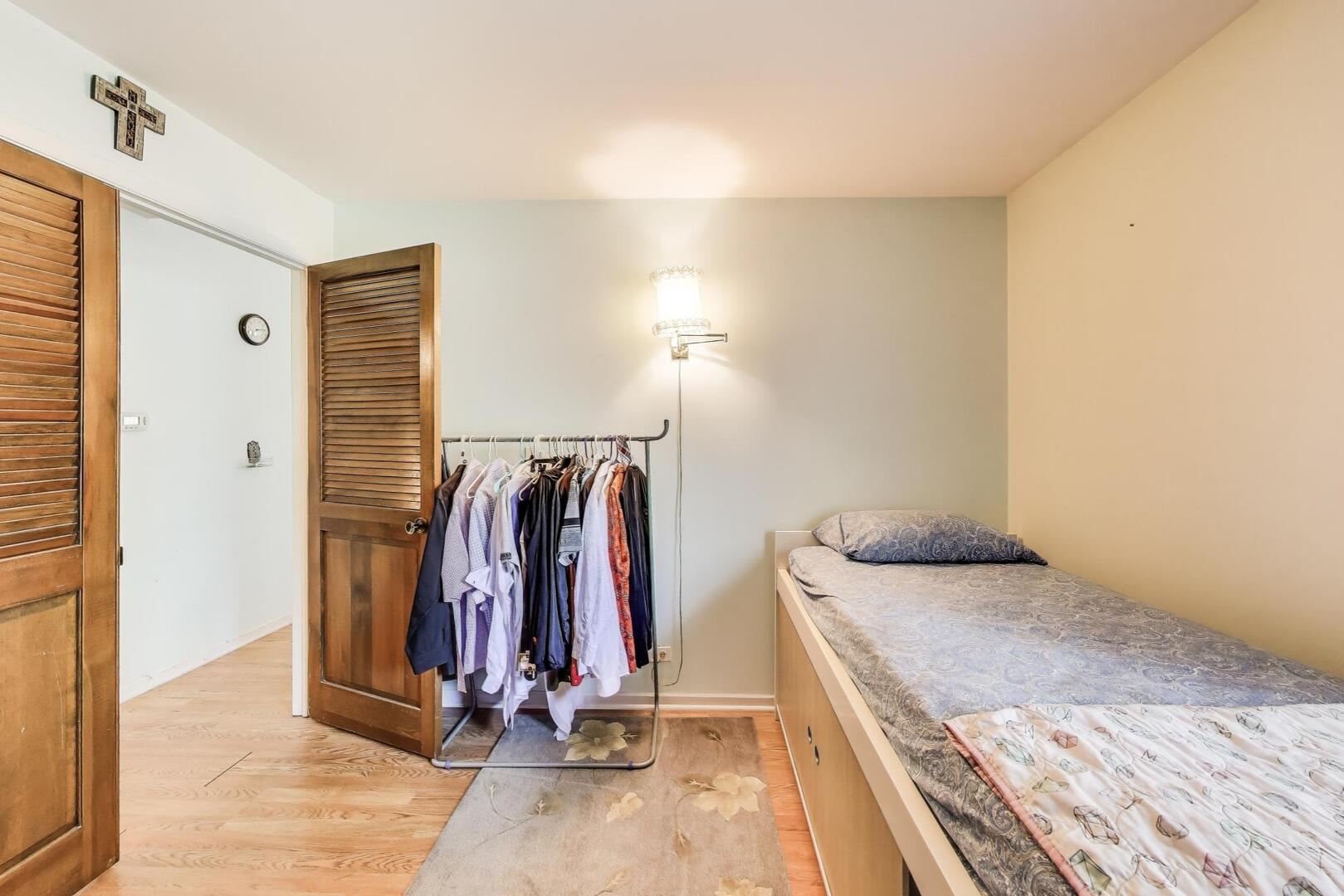 350 Newgate Court, Unit 2Z Schaumburg, IL 60193 - Photo 12 of 18 a view of a room with clothes and shoes