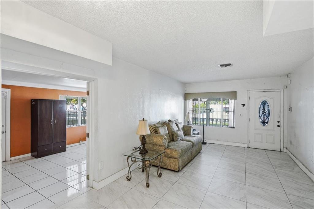 1320 Northwest 86th Street Miami, FL 33147 - Photo 12 of 41 a living room with furniture and windows