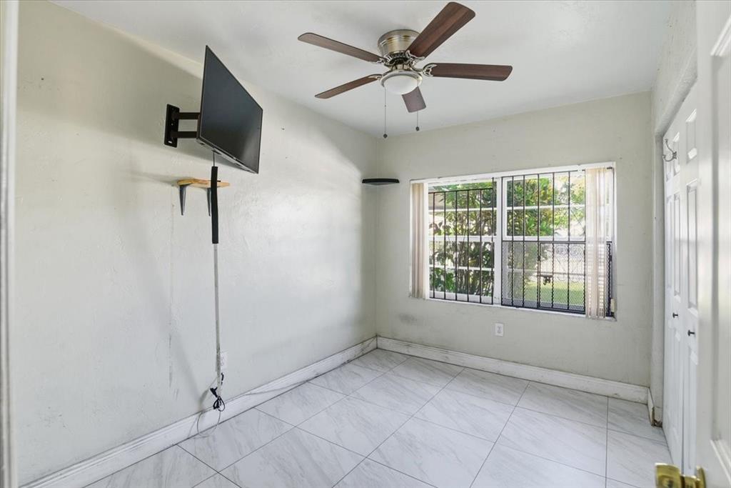 1320 Northwest 86th Street Miami, FL 33147 - Photo 21 of 41 a view of an empty room with a window
