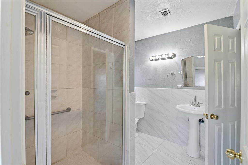 1320 Northwest 86th Street Miami, FL 33147 - Photo 25 of 41 a bathroom with a shower and a sink