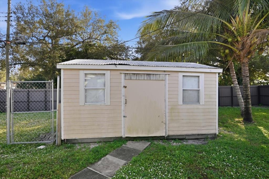 1320 Northwest 86th Street Miami, FL 33147 - Photo 33 of 41 a view of a house with a yard