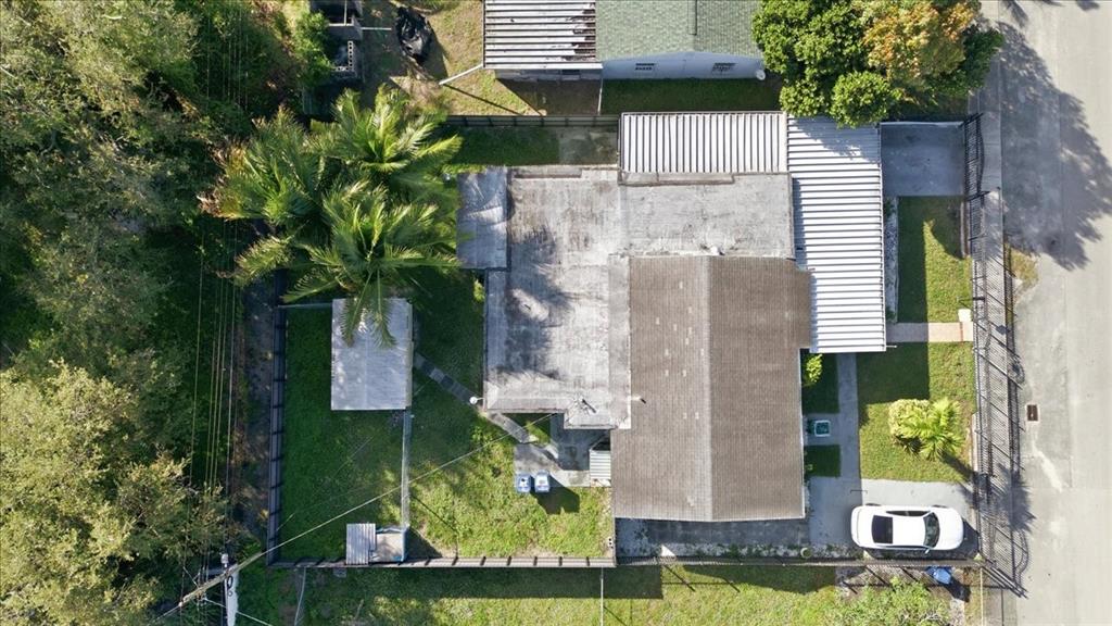 1320 Northwest 86th Street Miami, FL 33147 - Photo 39 of 41 an aerial view of residential house with outdoor space and trees all around