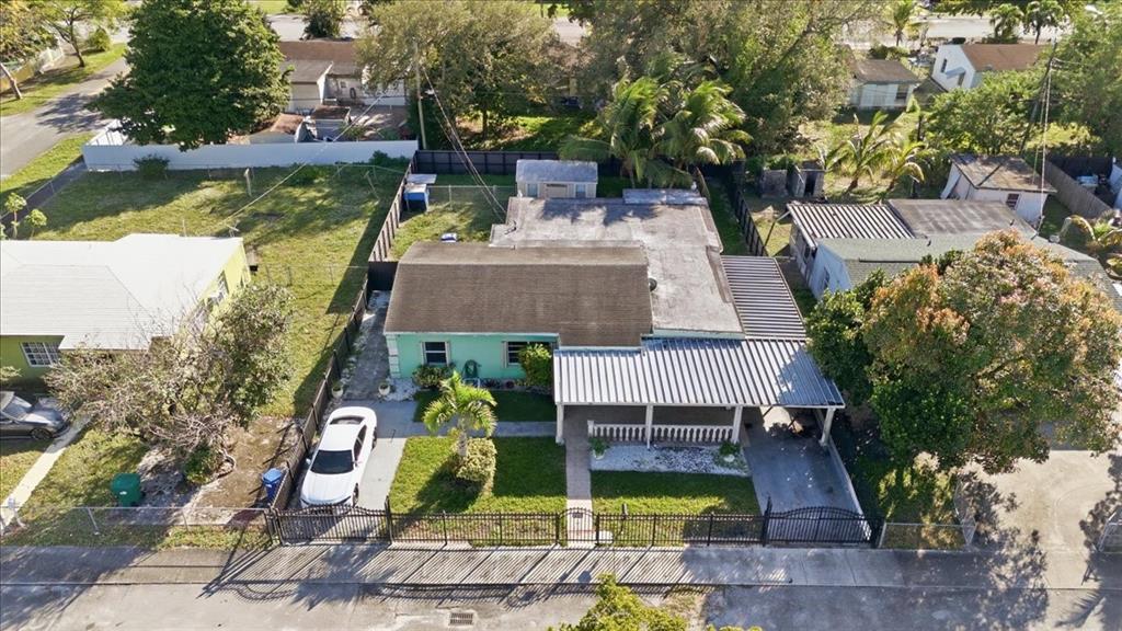 1320 Northwest 86th Street Miami, FL 33147 - Photo 40 of 41 an aerial view of a house with swimming pool garden and patio