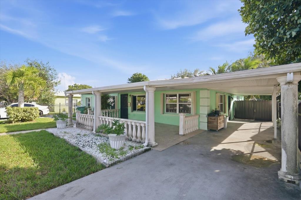 1320 Northwest 86th Street Miami, FL 33147 - Photo 6 of 41 a view of a house with backyard porch and sitting area