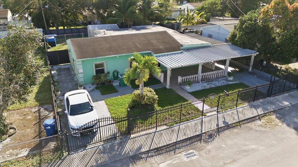 1320 Northwest 86th Street Miami, FL 33147 - Photo 8 of 41 an aerial view of a house with swimming pool and porch