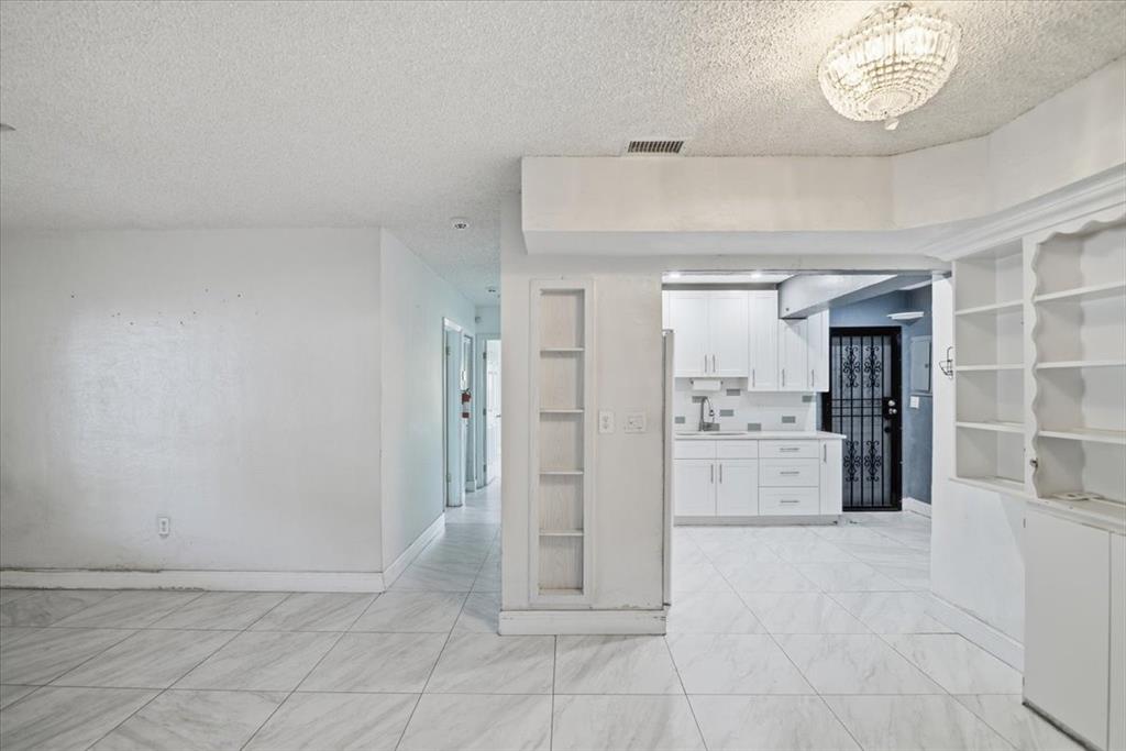 1320 Northwest 86th Street Miami, FL 33147 - Photo 9 of 41 a view of a kitchen with refrigerator and cabinets