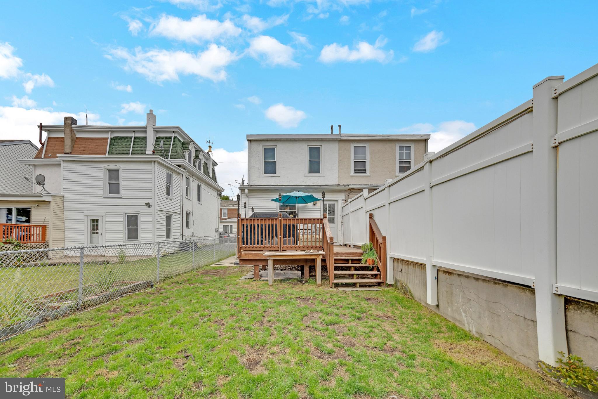 337 Lemonte Street Philadelphia, PA 19128 - Photo 17 of 18 a view of a house with a yard porch and sitting area