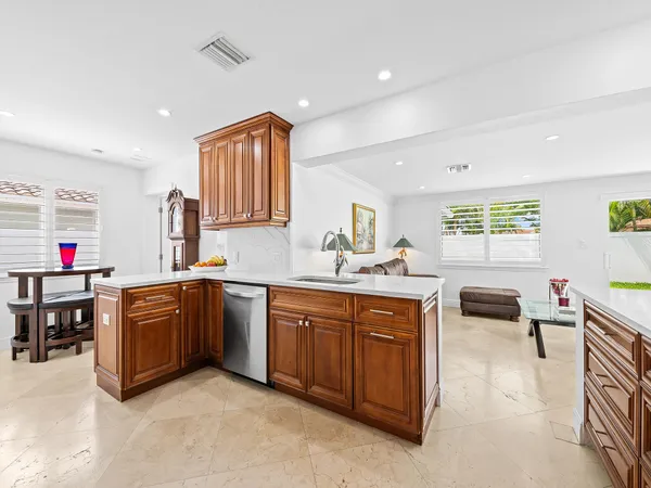 a large kitchen with stainless steel appliances lots of counter top space