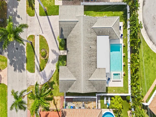aerial view of a multi story residential apartment building with swimming pool