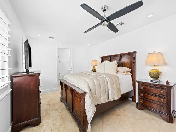 a bedroom with a bed and dresser