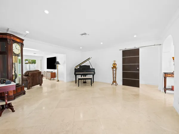 a view of a livingroom with furniture and a flat screen tv