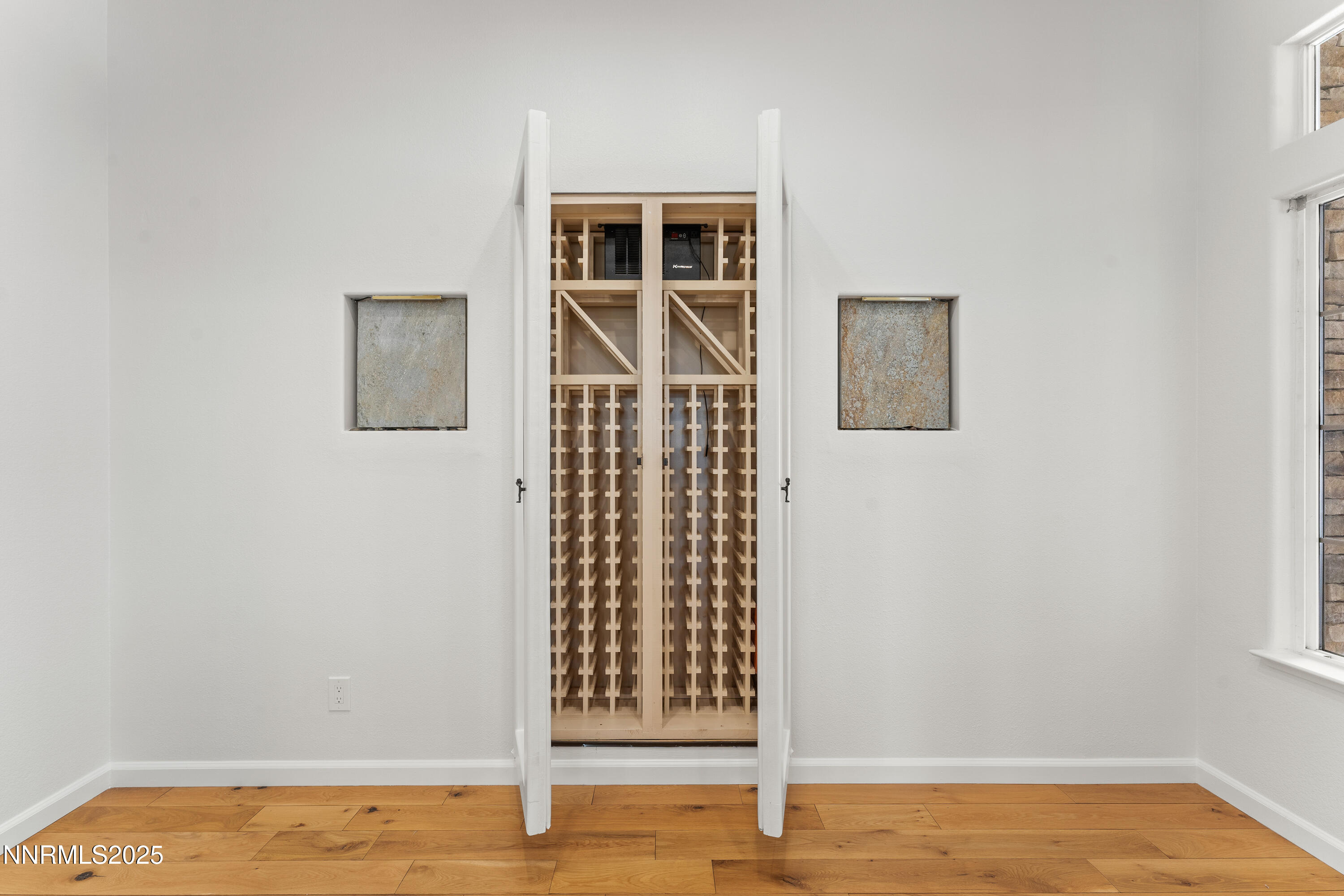 4991 West Albuquerque Road Reno, NV 89511 - Photo 20 of 60 a view of empty room with wooden floor and fan