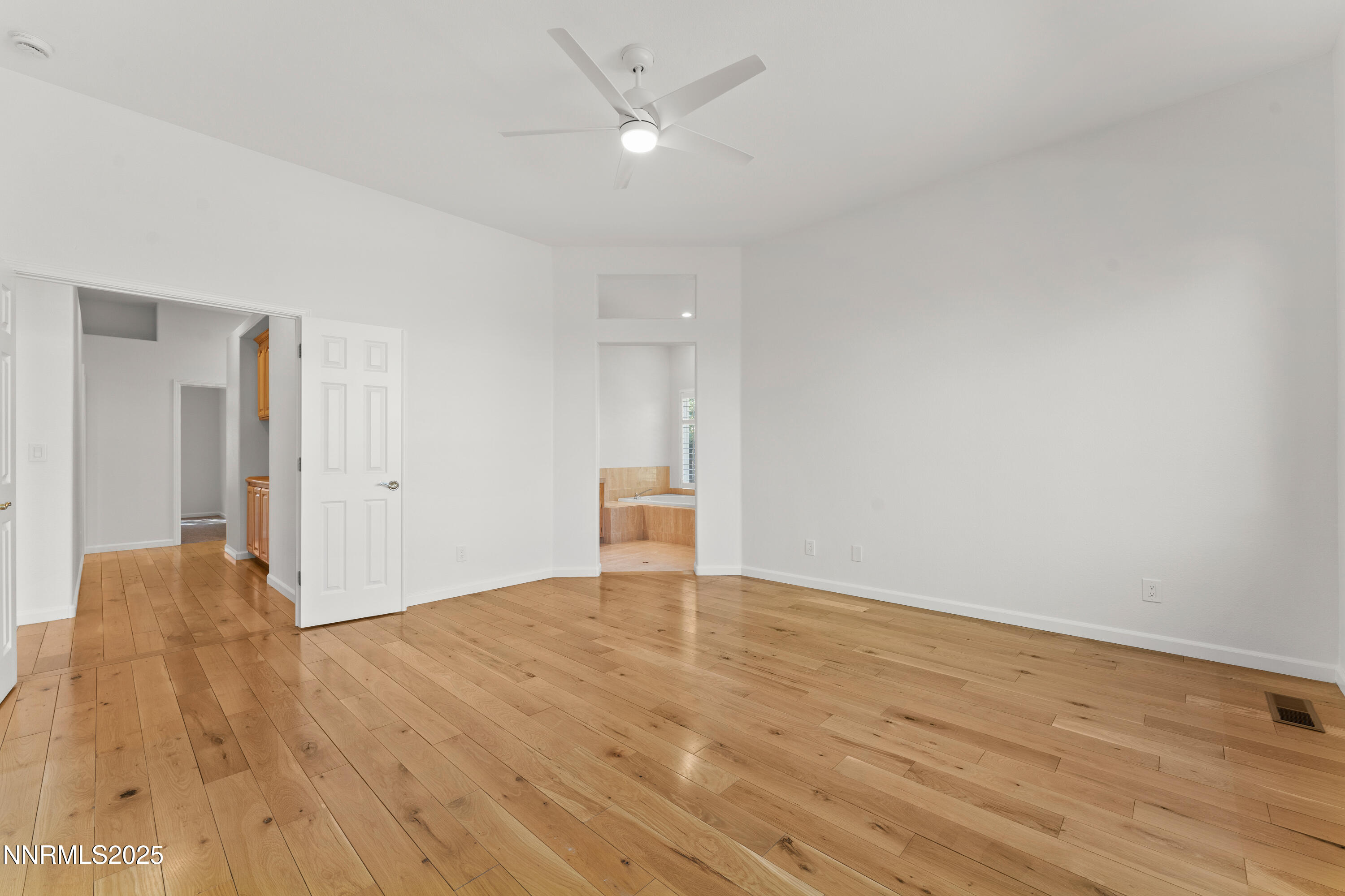 4991 West Albuquerque Road Reno, NV 89511 - Photo 24 of 60 a view of an empty room with wooden floor