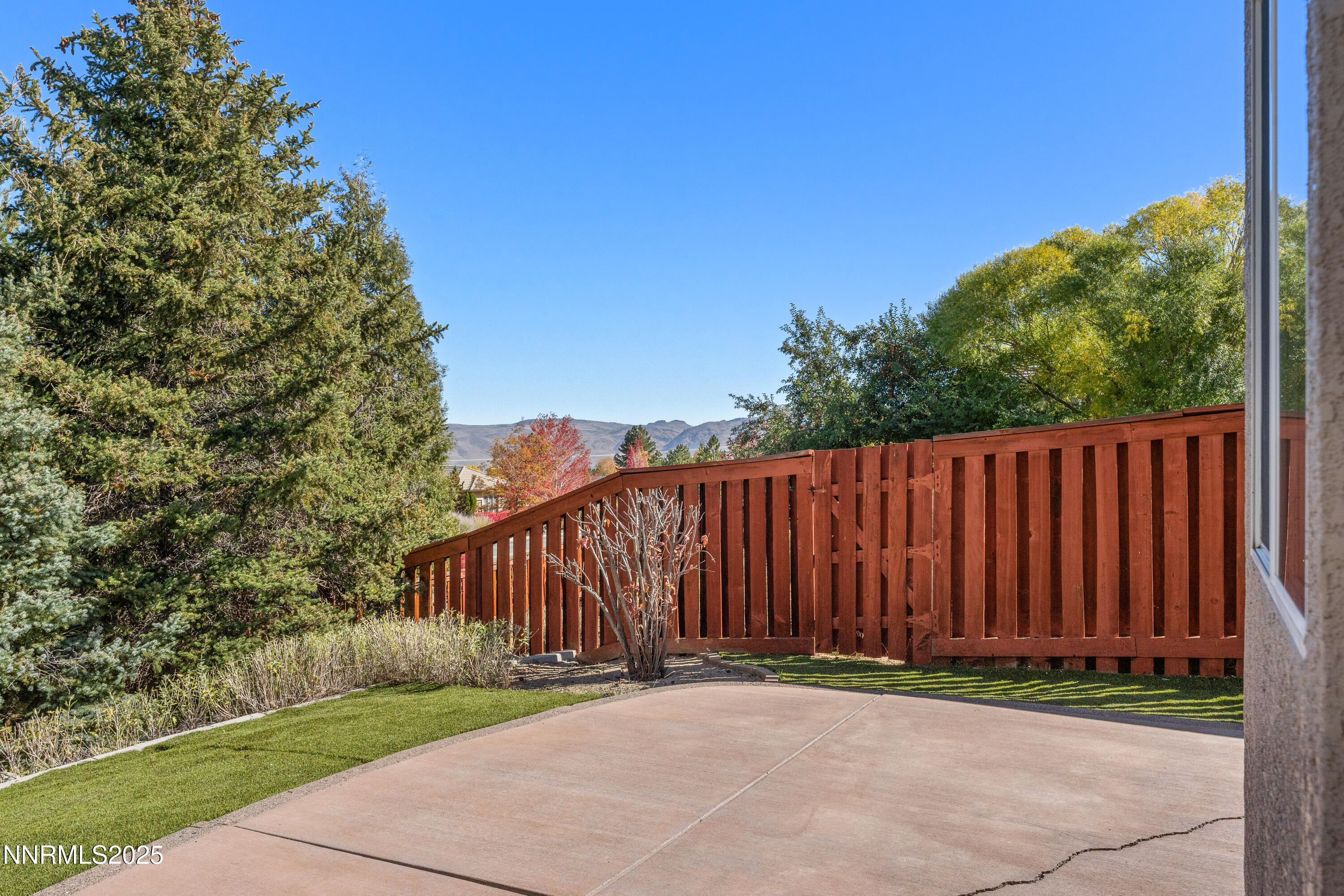 4991 West Albuquerque Road Reno, NV 89511 - Photo 39 of 60 a backyard of a house with lots of green space
