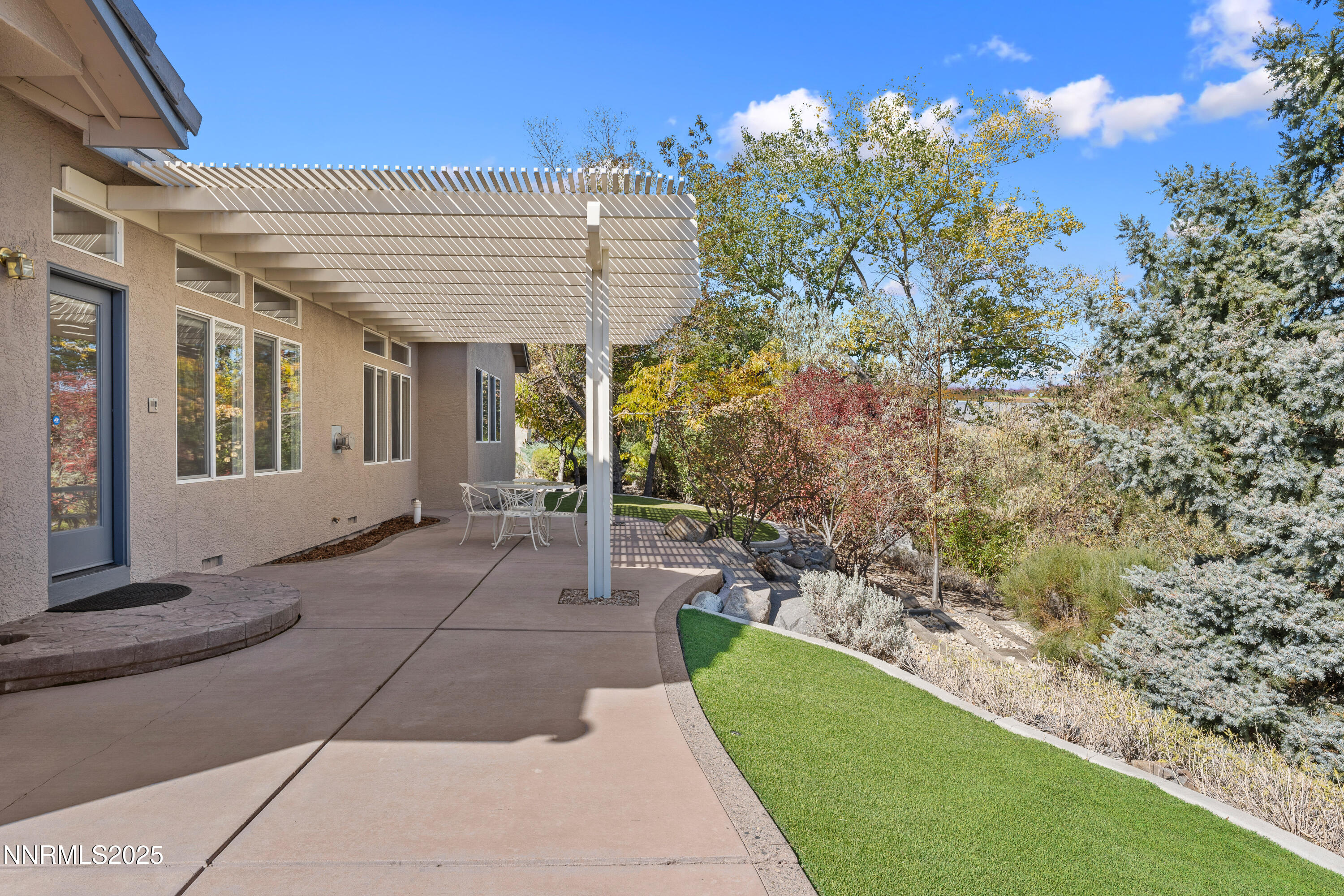 4991 West Albuquerque Road Reno, NV 89511 - Photo 41 of 60 a view of a house with a yard
