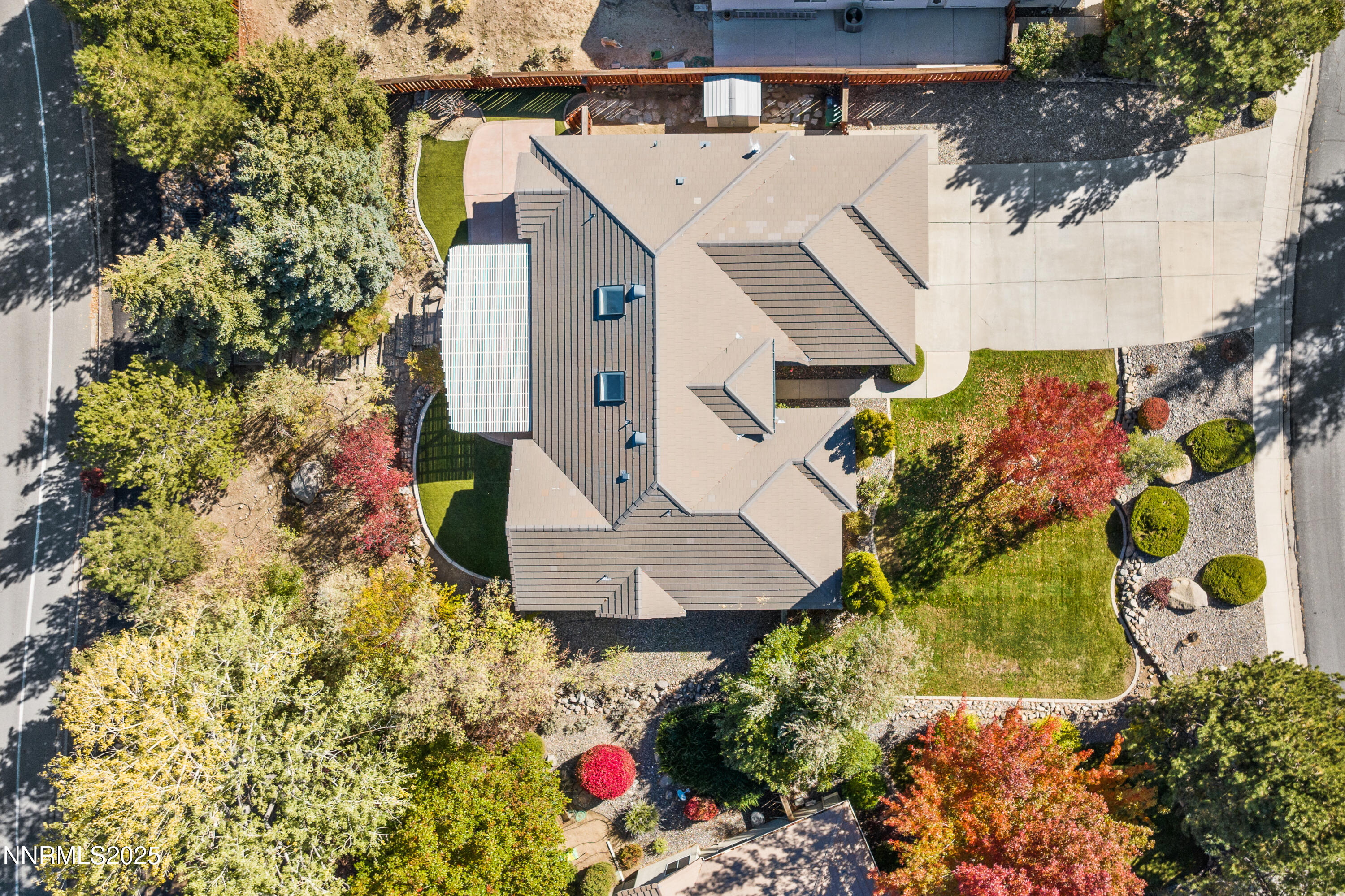 4991 West Albuquerque Road Reno, NV 89511 - Photo 50 of 60 an aerial view of a house with a yard and large trees