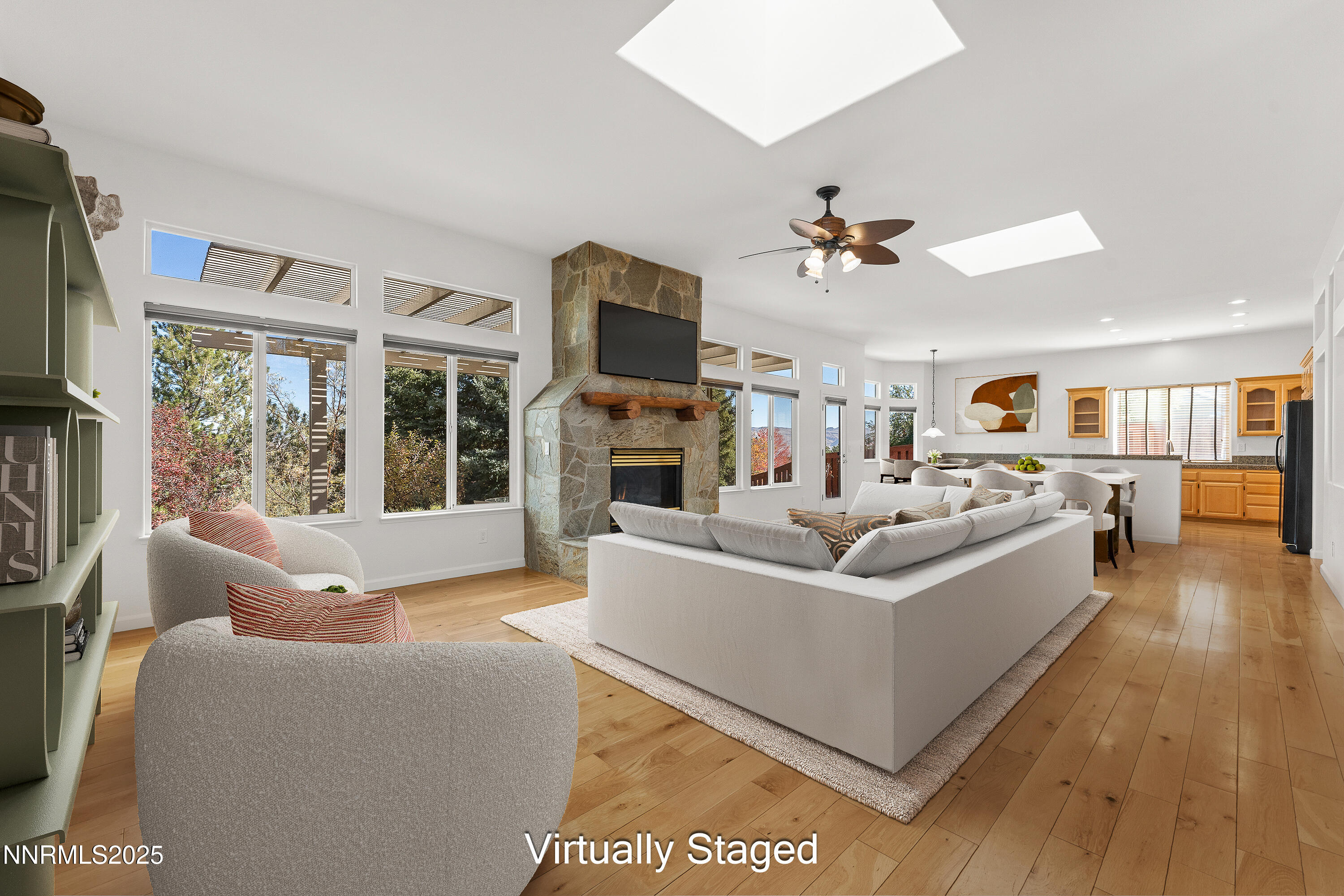 4991 West Albuquerque Road Reno, NV 89511 - Photo 5 of 60 a living room with furniture a fireplace and a flat screen tv