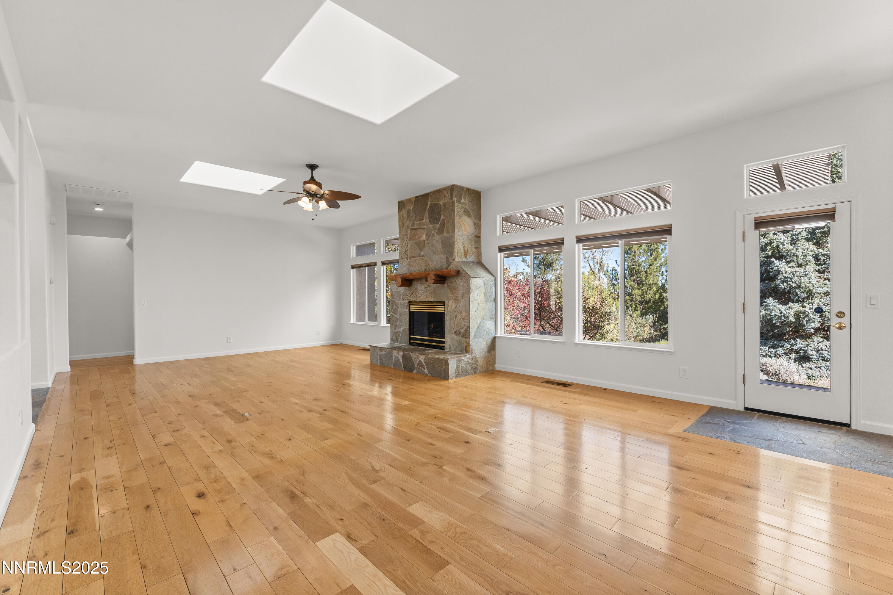 4991 West Albuquerque Road Reno, NV 89511 - Photo 9 of 60 a view of empty room with window and fireplace