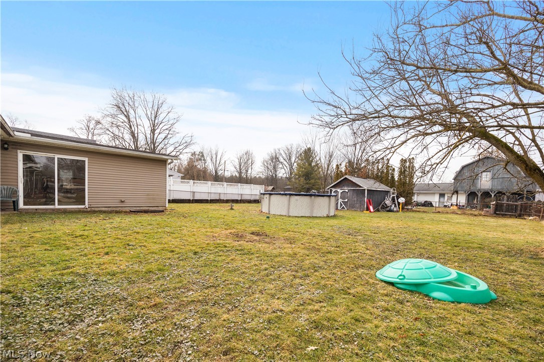 12452 Island Road Grafton, OH 44044 - Photo 34 of 39 View of yard with an outdoor pool