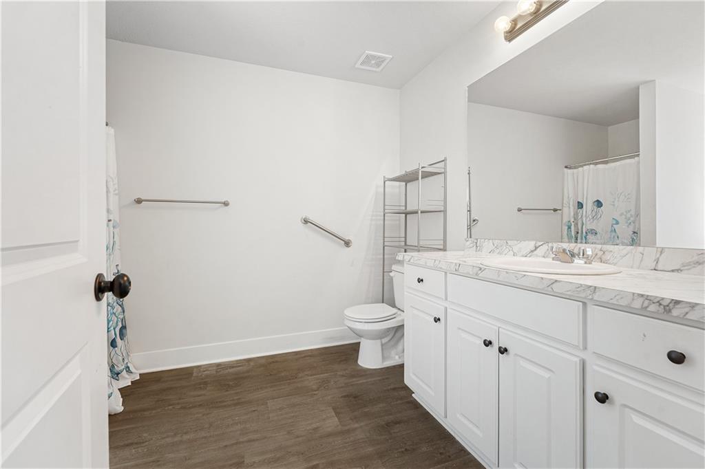 328 Walnut Drive Hartwell, GA 30643 - Photo 20 of 33 a bathroom with a granite countertop sink toilet and shower
