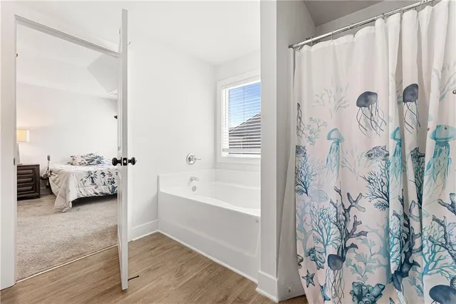 a en suite bathroom with a sink and a tub